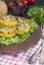 Baked Patty Pan Squash stuffed with meat and cheese, decorated with herbs. Baked zucchini. Wood background. Summer menu. Close-up