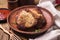 Baked pieces of pork in a clay plate