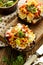 Baked portobello mushrooms stuffed with quinoa, vegetables and cheese with herbs