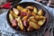 Baked potato with bacon, rosemary, olive oil and sea salt