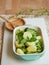 baked potato and broccoli with basil garnish