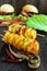 Baked potato circles on a bamboo skewer with spices homemade chips.