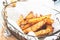 Baked potato wedges on basket - homemade snack made from vegetable. Healthy