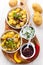 Baked potatoes with chutney and sour cream