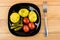 Baked potatoes with dill, pickled gherkins and tomatoes, fork