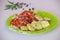 Baked potatoes and vegetables with spices. Delicious stewed potatoes with tomatoes, sweet red pepper and spices