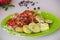 Baked potatoes and vegetables with spices. Delicious stewed potatoes with tomatoes, sweet red pepper and spices