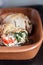 Baked poultry fillet stuffed with soft cheese, tomatoes and herb