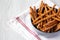 Baked Pretzel Sesame Sticks in a Bowl, low angle view. Space for text