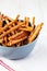 Baked Pretzel Sesame Sticks in a Bowl, side view. Close-up