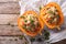 Baked pumpkin with couscous, meat, vegetables and cheese close-up