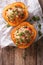 Baked pumpkin with couscous, meat, vegetables and cheese close-up