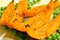 Baked pumpkin slices arranged with green peas and french salt