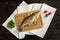 Baked rainbow trout on a wooden board for serving