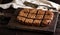 Baked rectangular chocolate brownie pie is cut into squares