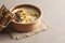 Baked rice pudding turkish dessert sutlac in earthenware casserole with cinnamon sticks