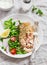 Baked salmon with lemon grain crust and fresh vegetable salad with peas, spinach, radishes and cherry tomatoes.