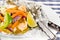 Baked salmon with vegetables in a foil with sause end lime wedge