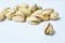 Baked salty pistachio nut arranging on white background