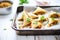 baked samosas on parchment paper in a baking tray