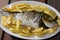 Baked sea bream with potatoes