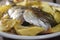 Baked sea bream with potatoes