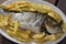 Baked sea bream with potatoes