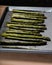 Baked seasoned asparagus on baking sheet