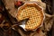 Baked sliced apple lattice pie crust on sackcloth on rustic wooden table