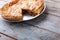 Baked sliced stuffed pie in plate on wooden table