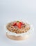 Baked strawberry mini crumble cake on recycle Mini Wooden Baking Mold, white background, copy space, selective focus. Homemade