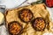 Baked stuffed Portobello mushrooms. Gray  background. Top view