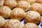 Baked sweet buns on a baking sheet with a ruddy crust, homemade delicious cakes