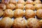 Baked sweet buns on a baking sheet with a ruddy crust, homemade delicious cakes