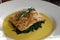 Baked tilapia over steamed spinach