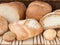 Baked to Perfection: Exquisite Bread Selections on a Beautiful Wood Background