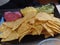 Baked tortilla chips served with a trio of vegetable dips