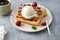 Baked traditional Belgium waffles with ice cream and cherries. Breakfast.