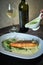 Baked trout with sauce and broccoli