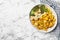 Baked yellow carrot with broccoli and cauliflowers on white marble table, top view. Space for text