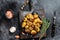 Baked youg potato with thyme in a pan Black background. Top view