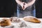 Baker cooking bread. Man slaps flour. Food concept.