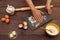 Baker hands flour a dough board on wooden table