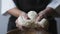 Baker hands kneading dough