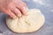 Baker hands preparing khachapuri on kitchen table. View on cook