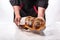 Baker holding fresh baked challah jewish bread. Israeli authentic food