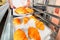 The baker keeps hot fresh croissants against the backdrop of the oven. Croissants close-up.