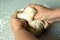 Baker kneading a yeast white bread dough