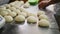Baker makes pie of delicious dough on metal table closeup
