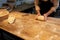 Baker making bread dough at bakery kitchen